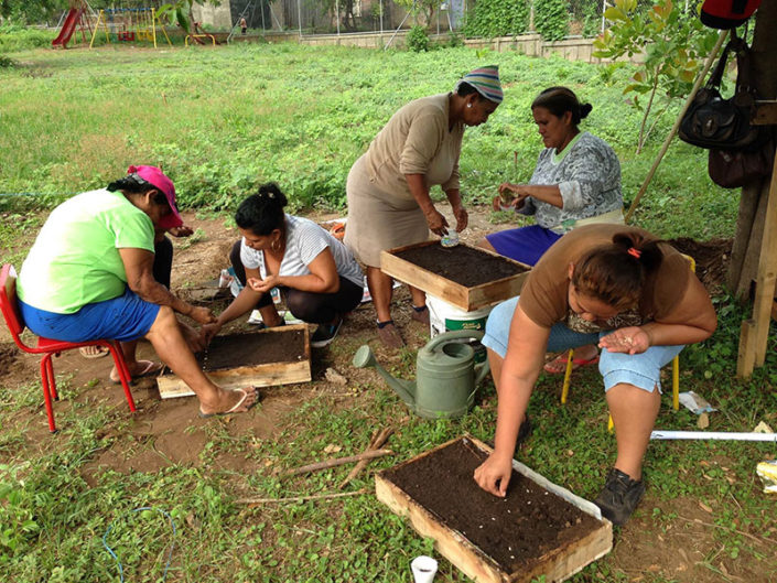 members of La Fortaleza with seed box members of La Fortaleza with seed box