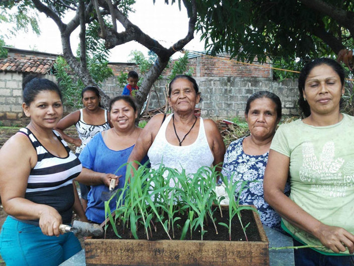 members of La Fortaleza with seed box members of La Fortaleza with seed box